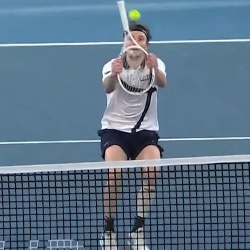 Alexander Bublik mid-swing on a trick shot
